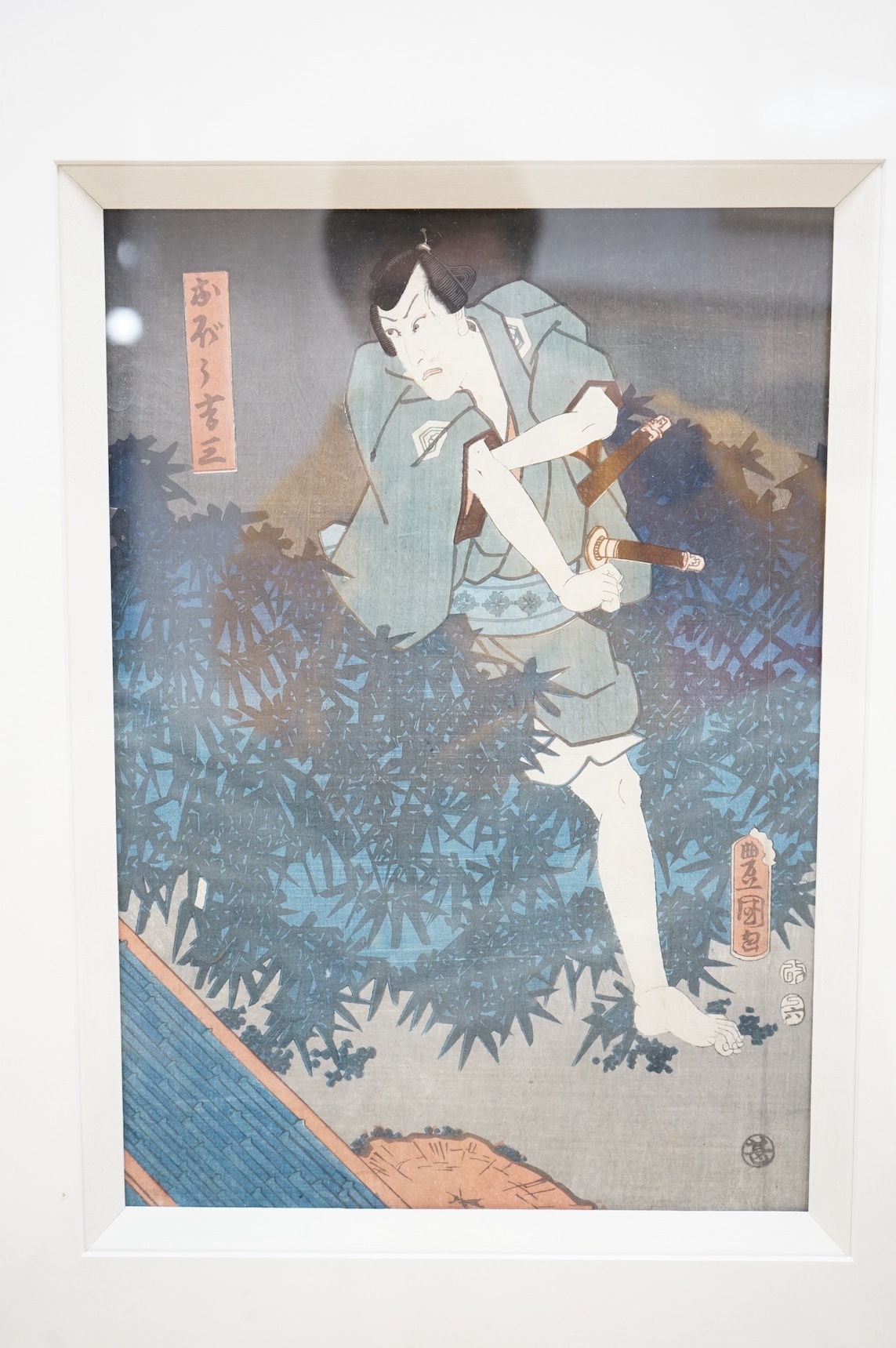 Four Japanese woodblock prints, to include: after Toyokuni - kabuki actors together with a Chinese printed booklet, largest 35 x 23cm. Condition - good